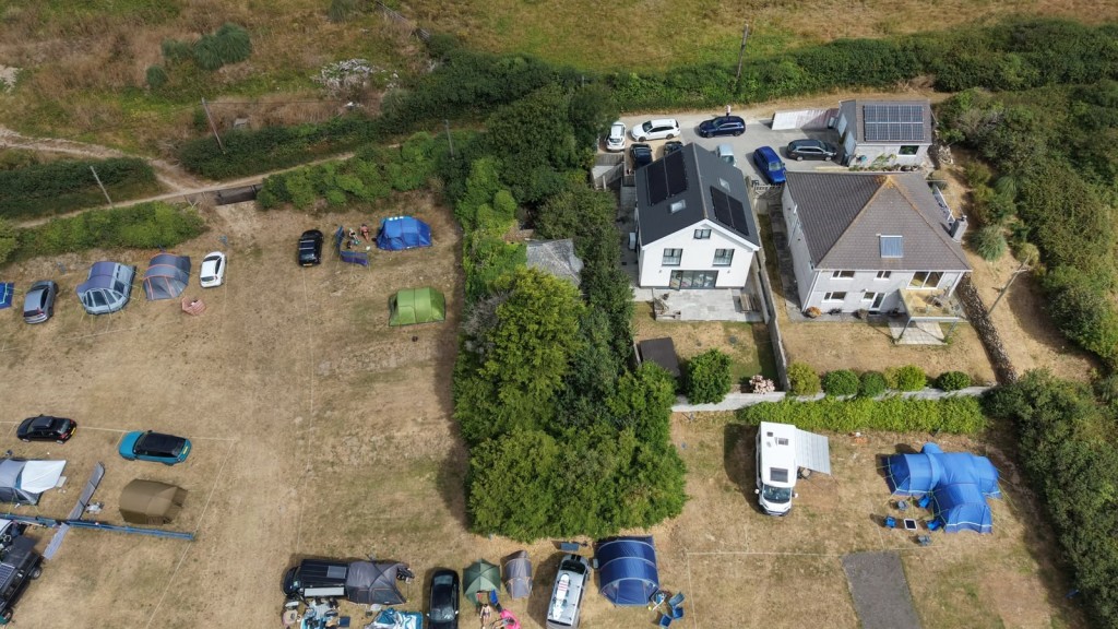 Lot: 45199 - DETACHED BUNGALOW FOR IMPROVEMENT OR REDEVELOPMENT IN POPULAR COASTAL TOWN - Aeiral view of the property with country lane to the house
